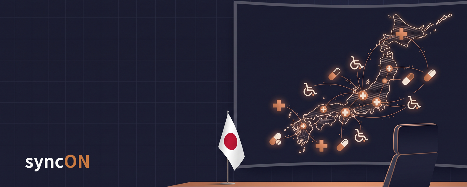 日本の地図の上で、病院・創薬・介護のアイコンが光の線でつながる司令室のイメージ